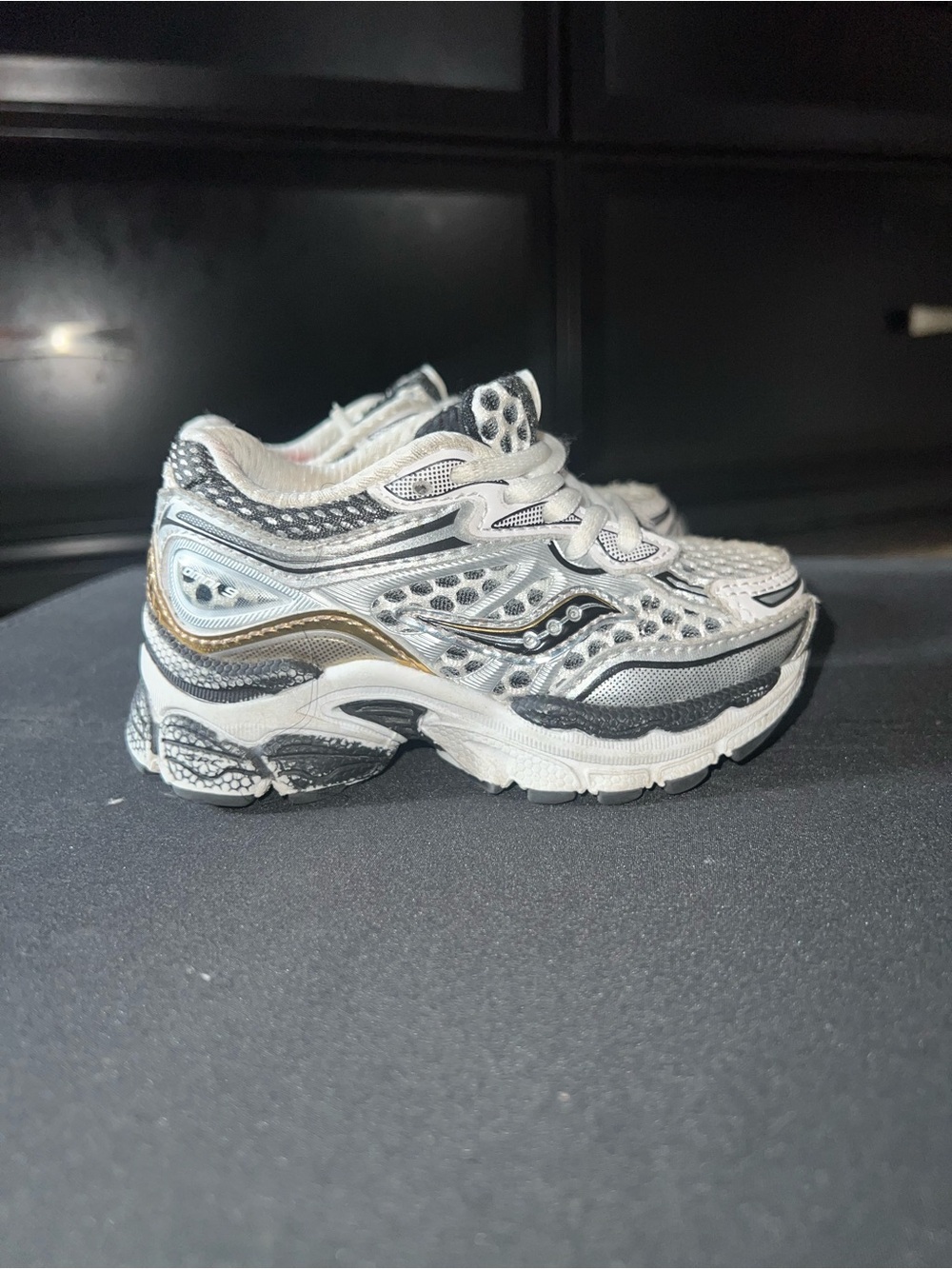 Kids White and Black Athletic Sneakers with Gold Accent